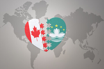 puzzle heart with the national flag of canada and Macau on a world map background.Concept.