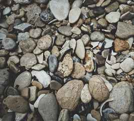 Brick brown. Rock pile. Rock background. Rock texture. Stone background. Paint spots. Rock surface with cracks. Grunge Rough structure. Abstract texture.