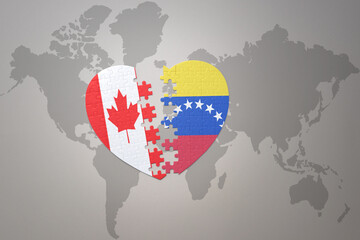 puzzle heart with the national flag of canada and venezuela on a world map background.Concept.