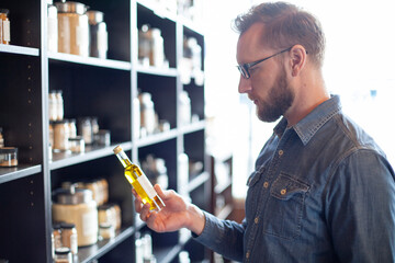 Male customer looking at product in spice store