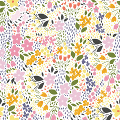 Summer wildflowers, floral seamless pattern with colorful flowers and abstract green plants on white background. Delicate pattern print for textile or wrapping paper.