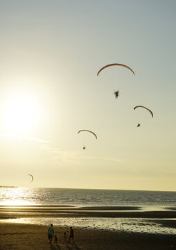 Silhouette Of Para Gliding At Sunset Sky With Sea Background