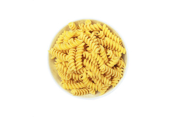 Fusilli italian pasta in white ceramical bowl isolated on white background, top view.