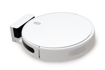 Isolated on white robot vacuum cleaner is charging near the docking station. Modern technologies to...