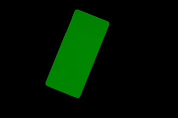 green mobile phone screen on a black background