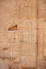 Different hieroglyphs on the walls and columns in the Karnak temple. Karnak temple is the largest complex in ancient Egypt.