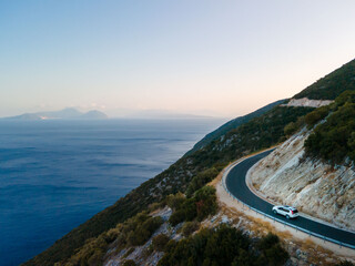 car travel concept moving by road in mountains with view of sea shore