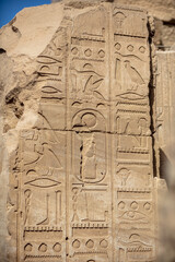 Different hieroglyphs on the walls and columns in the Karnak temple. Karnak temple is the largest complex in ancient Egypt.