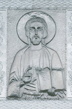 Ancient metal icon of Jesus Christ on the facade of the old church