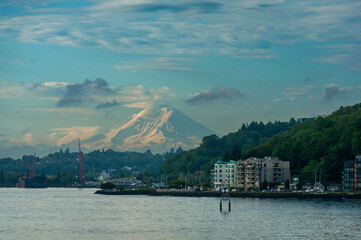 View of Mt. Rainier from Elliott Bay Overlooking West Seattle and Alki Beach. Seen from a ferry boat making a crossing from downtown Seattle to Bainbridge island.