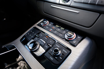 Air condition button inside a luxury car.
