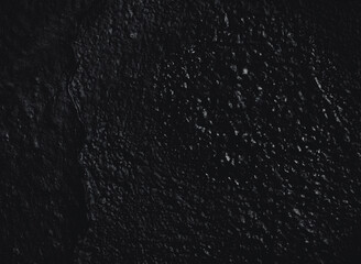 Abstract texture. Paint spots wall. Black texture. Stone background. Dark marble. Rock texture. Rock surface with cracks. Rock pile. Grunge Rough structure.