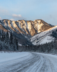 Amazing landscape views in Alberta during winter time with snow covered landscape at sunrise. 