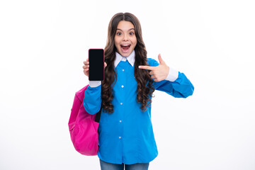 Schoolgirl student with school bag using smart phone. School uniform. Excited face. Amazed expression, cheerful and glad.