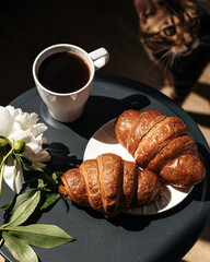 croissants with black coffee in the morning