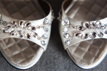 Wedding shoes with jewels on the grey floor