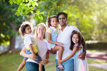 Family in summer park. Parents and kids outdoor.