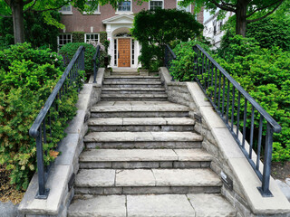 Long stone staircase going to house at the top of a hill