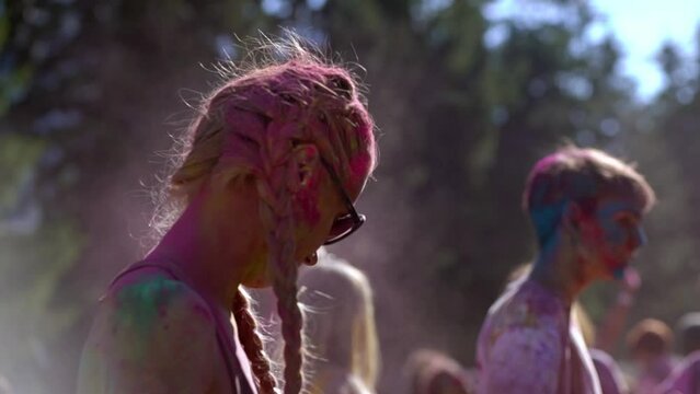 Portrait of an attractive young woman smiling at Holi festival