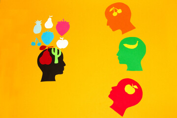 
knowledge is represented by fruit, several heads learn from one head who has the most knowledge, creative concept teacher and students