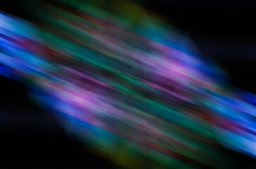 abstract with blurred ultraviolet light motion effect on black background