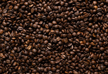roasted coffee bean background throughout the frame 