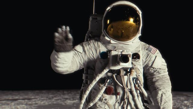 Astronaut waving on the surface of the moon. Highly realistic CGI animation. Elements furnished by NASA.