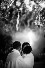 Bride and groom on the background of wedding fireworks