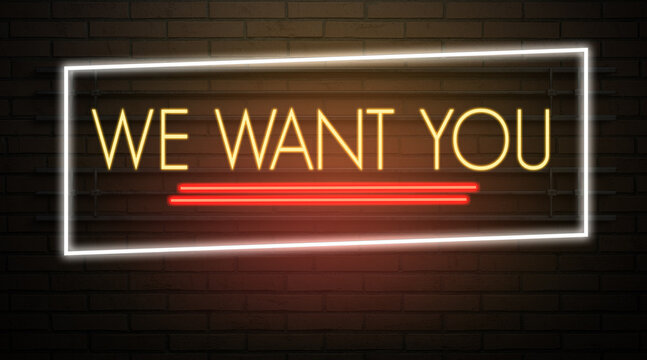 neon sign with message WE WANT YOU on a dark wall