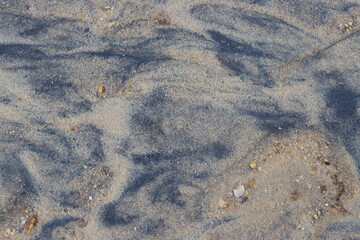 black sand, white sand and rocks. Texture of black sand and white sand for background