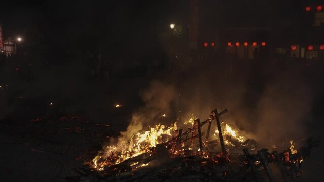 Remains of Festival Pyre at Hachiman Matsuri, Slow motion Pan over Fire in the Night