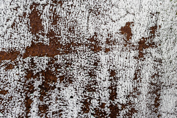 Texture of rusty metal. Rough metal surface with rust. Peeling white paint. Corroded and oxidized old iron. Rusted and aged metal sheet. Perfect for background and design in grunge style.