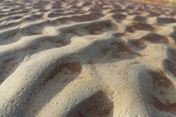 sand that forms waves, due to waves of water currents. natural background