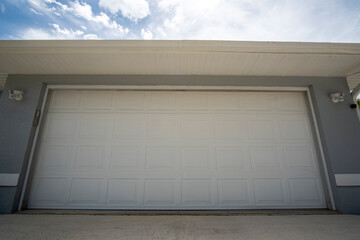 Wide garage double door and concrete driveway of new modern american house