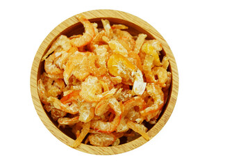 Pile of dried shrimp in wooden plate isolated on white background