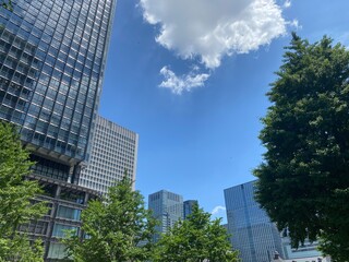 Obraz premium Tokyo station area buildings with the central city space, open public environment and streets of Marunouchi, year 2022 June 4th