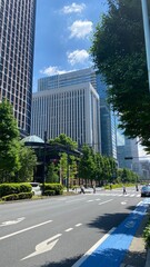 Fototapeta na wymiar Tokyo station area buildings with the central city space, open public environment and streets of Marunouchi, year 2022 June 4th