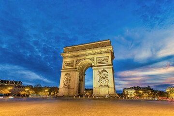 Paris France night city skyline at Arc de Triomphe and Champs Elysees