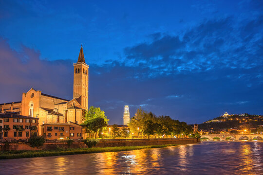 Verona Italy, night city skyline at Adige river and Basilica di Santa Anastasia
