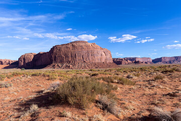 scenic view to monument valley with butte and blue sky