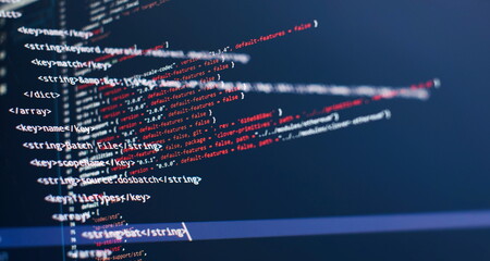 Security code on a computer display, close up. Database bits access stream visualisation. Php language and coding function developer