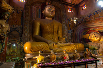 Ancient sculpture of a seated Buddha in the Wewrukannala Buduraja Maha Viharaya Buddhist Temple, Dickwella