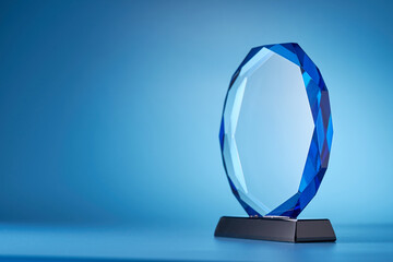 crystal trophy against blue background