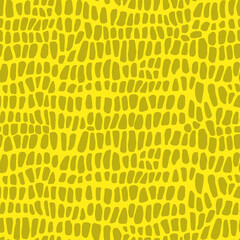 Abstract modern crocodile leather seamless pattern. Animals trendy background. Yellow decorative vector illustration for print, fabric, textile. Modern ornament of stylized alligator skin