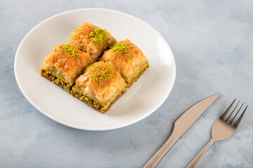 Pistachio baklava on a white plate
