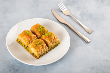 Pistachio baklava on a white plate