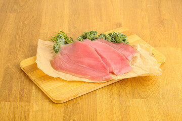 Raw salted tuna slice over board