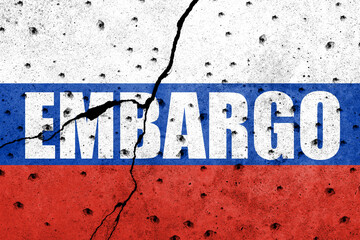Flag of Russia painted on a concrete wall with word EMBARGO