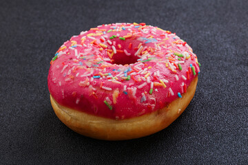 Sweet glazed struwberry donut with icing