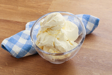 Italian soft mascarpone cheese in the bowl